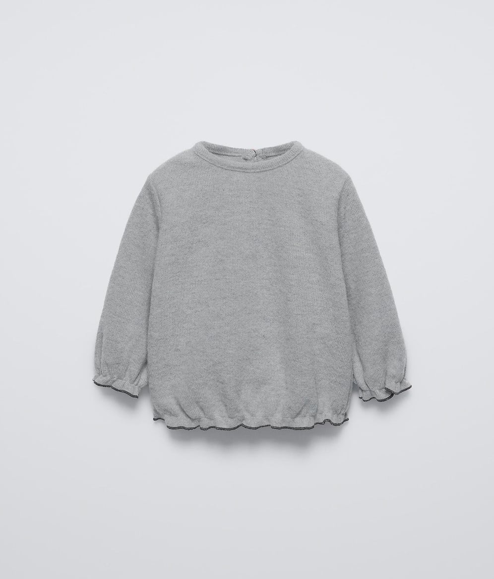 Ruffled knit sweater